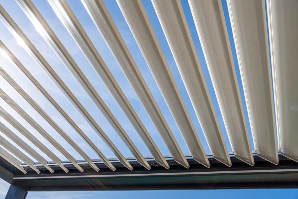 Trendy outdoor patio pergola with sun's rays passing through